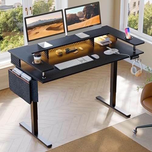 Bestier LED Gaming Electric Standing Desk Adjustable Height, 58×26 Inch Large Sit Stand Desk with Monitor Stand, Ergonomic Rising Office Desk with Headphone Hook & Storage Bag, 3D Carbon Fiber