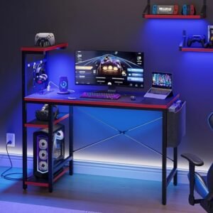 Bestier Gaming Desk with Power Outlets, 44 Inch Led Gamer Desk with 4 Tiers Reversible Shelves, PC Gaming Table with Headset Hook & Side Storage Bag for Bedroom (Black 3D Carbon Fiber)