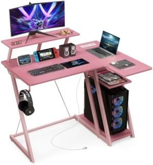 Tangkula L Shaped Gaming Desk with Power Outlets, Small Gaming Computer Desk 39inch with Storage Shelf, Corner Desk with Carbon Fiber Texture, Gamer Desk Gaming Table (Pink)